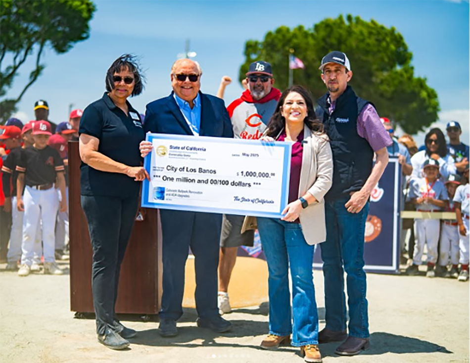 Joined Los Banos community leaders to present a check