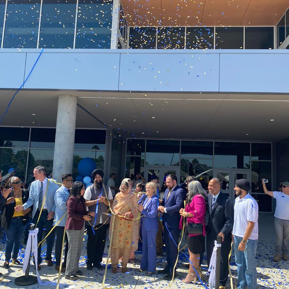 My staff and community leaders celebrate the ribbon cutting